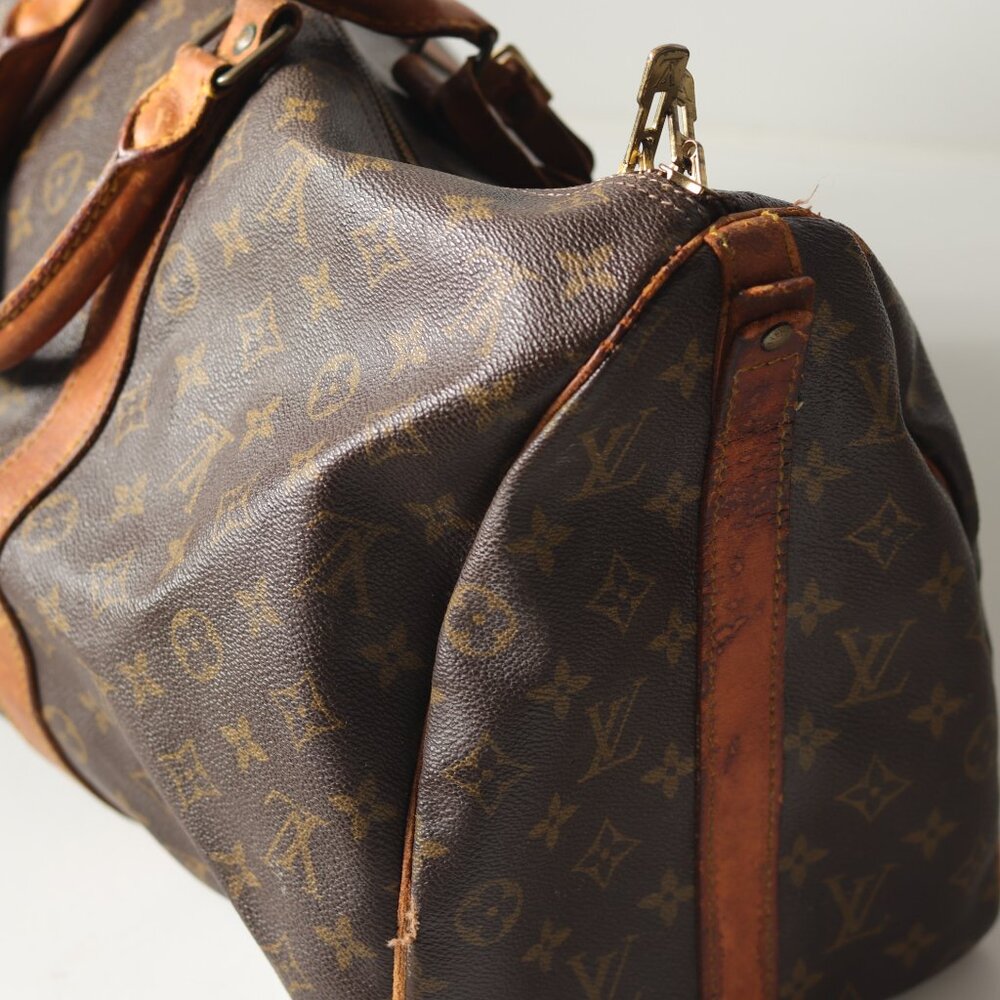SOLD-Well-loved well-traveled Louis Vuitton monogram duffle bag ISO new home